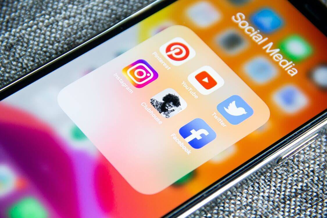 marketing image represented as an iphone showning the social media apps
